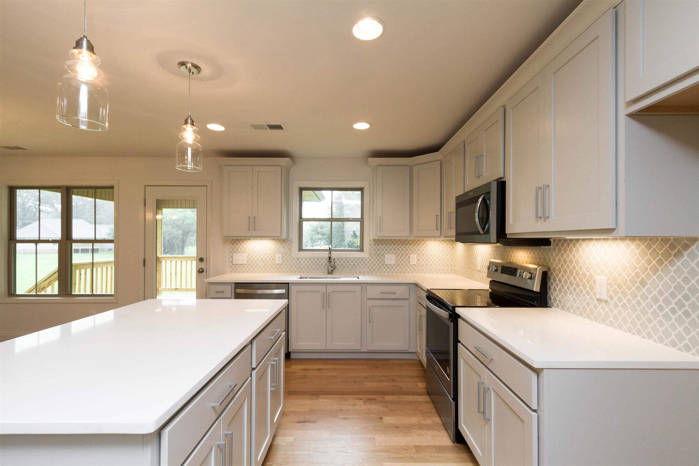 4121 Airport Road Springfield, TN 37172 - Photo 13 of 30 a kitchen with a sink stove and cabinets