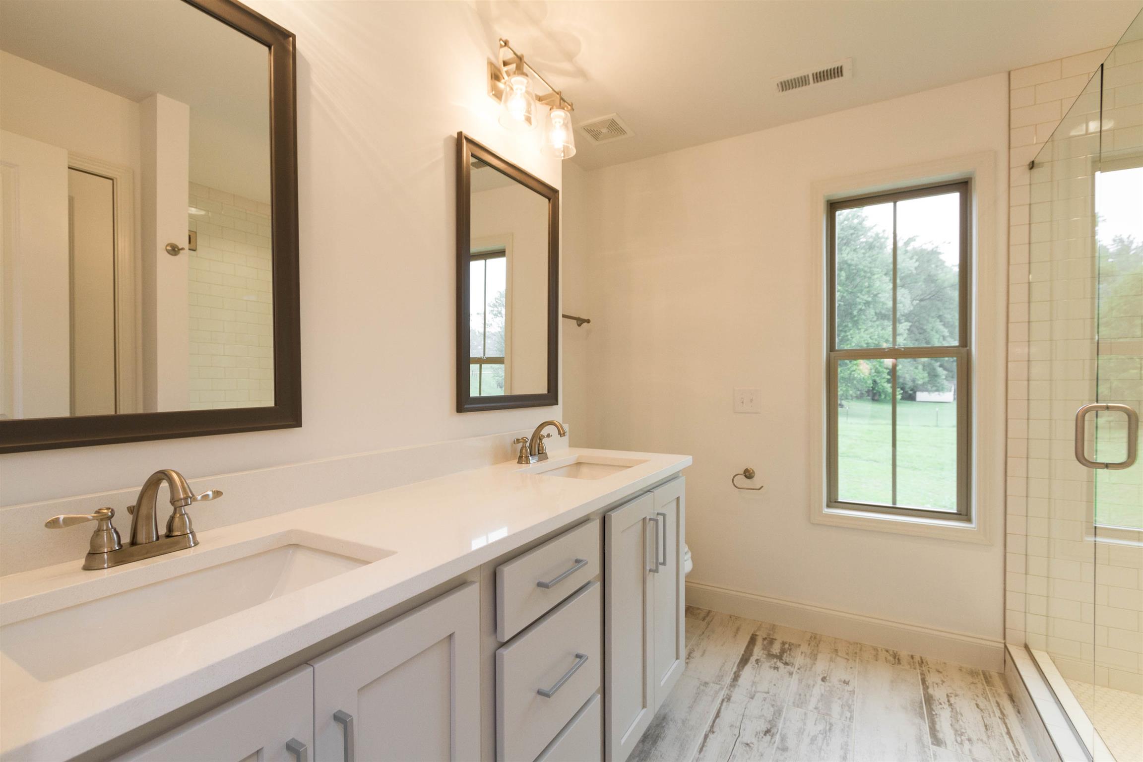 4121 Airport Road Springfield, TN 37172 - Photo 17 of 30 a bathroom with a sink and a mirror