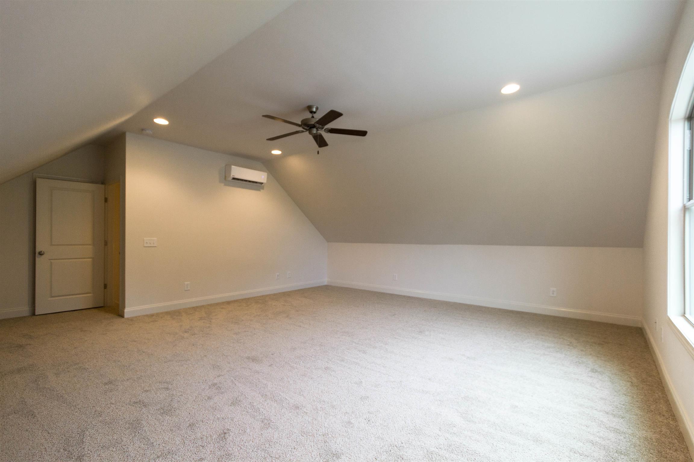4121 Airport Road Springfield, TN 37172 - Photo 20 of 30 an empty room with a empty space and a ceiling fan