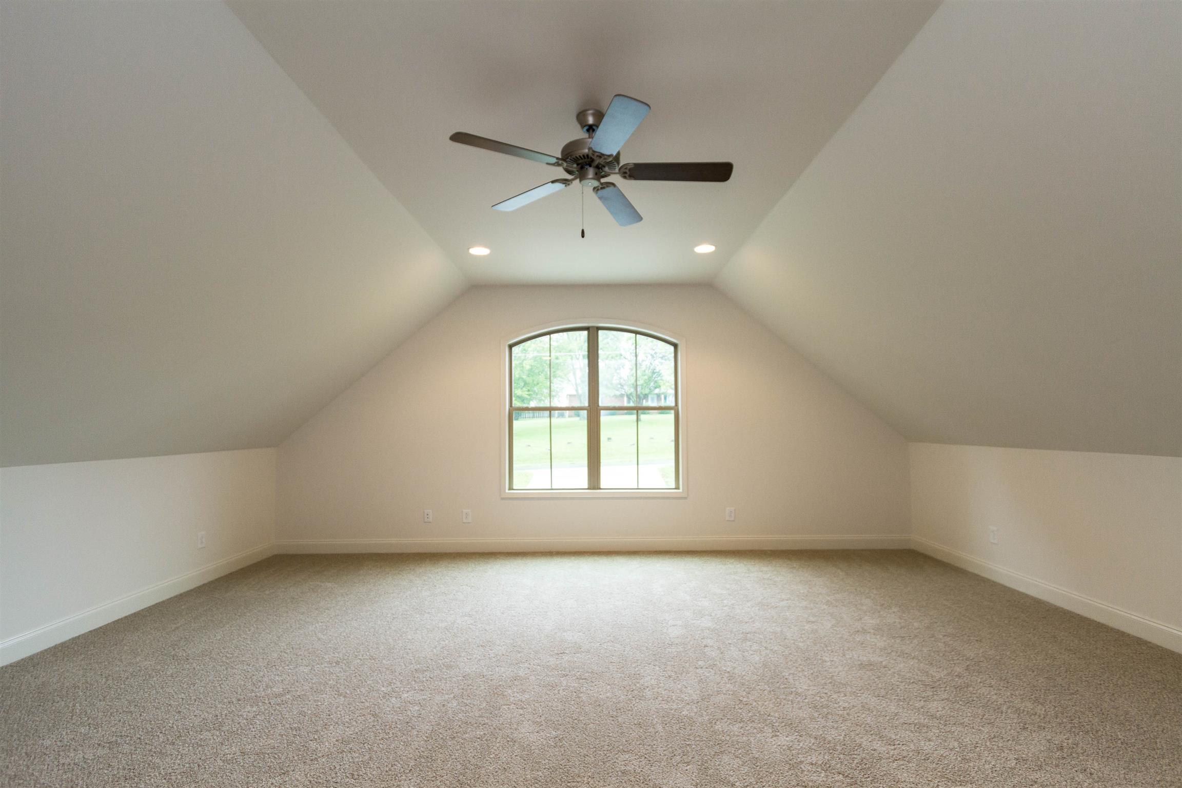 4121 Airport Road Springfield, TN 37172 - Photo 21 of 30 an empty room with a window and a ceiling fan