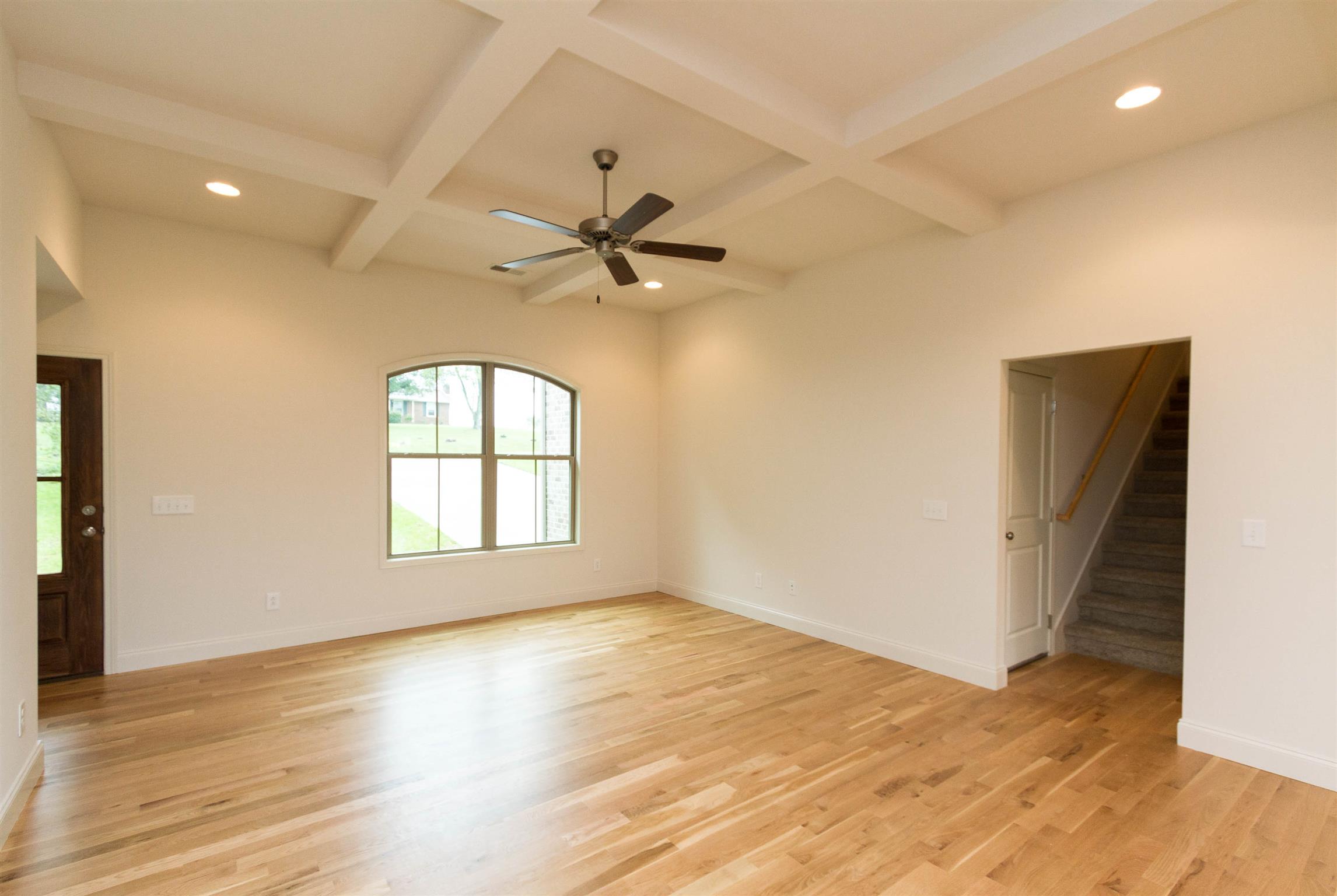 4121 Airport Road Springfield, TN 37172 - Photo 5 of 30 an empty room with wooden floor fan and windows