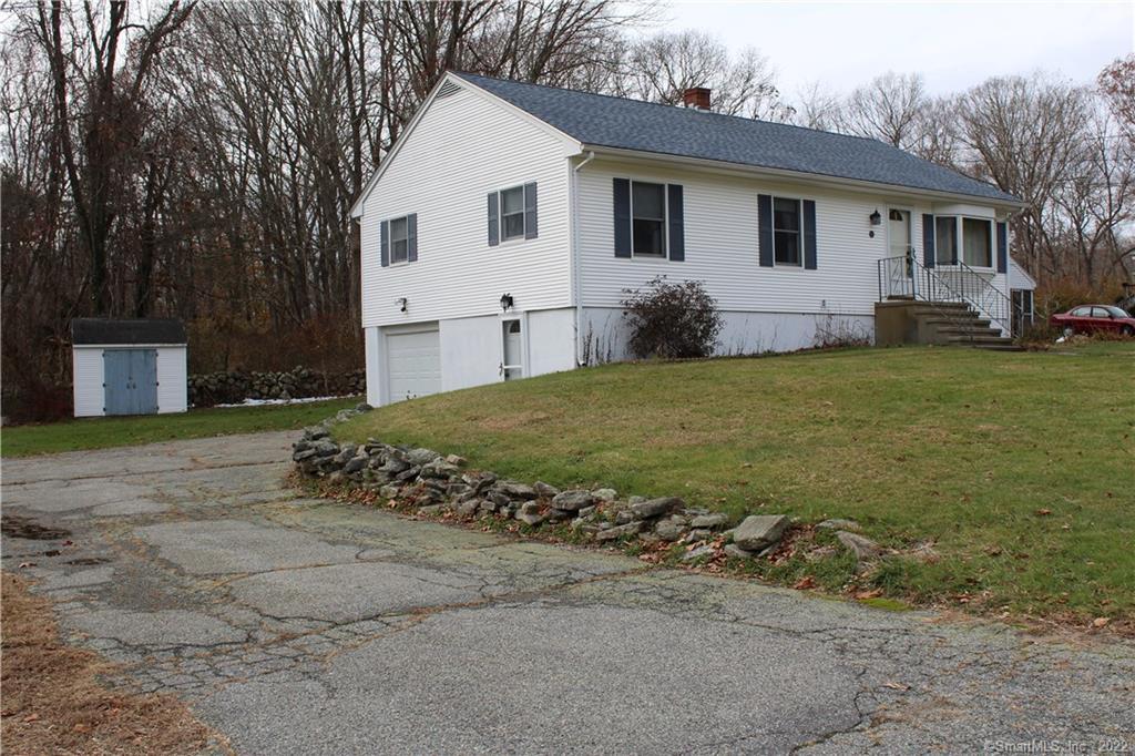 59 Spring Valley Road Groton, CT 06355 - Photo 1 of 1 a view of a yard in front of a white house with a large tree
