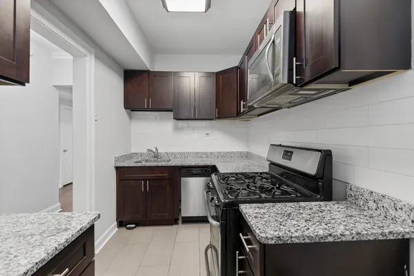 a kitchen with a stove and a sink
