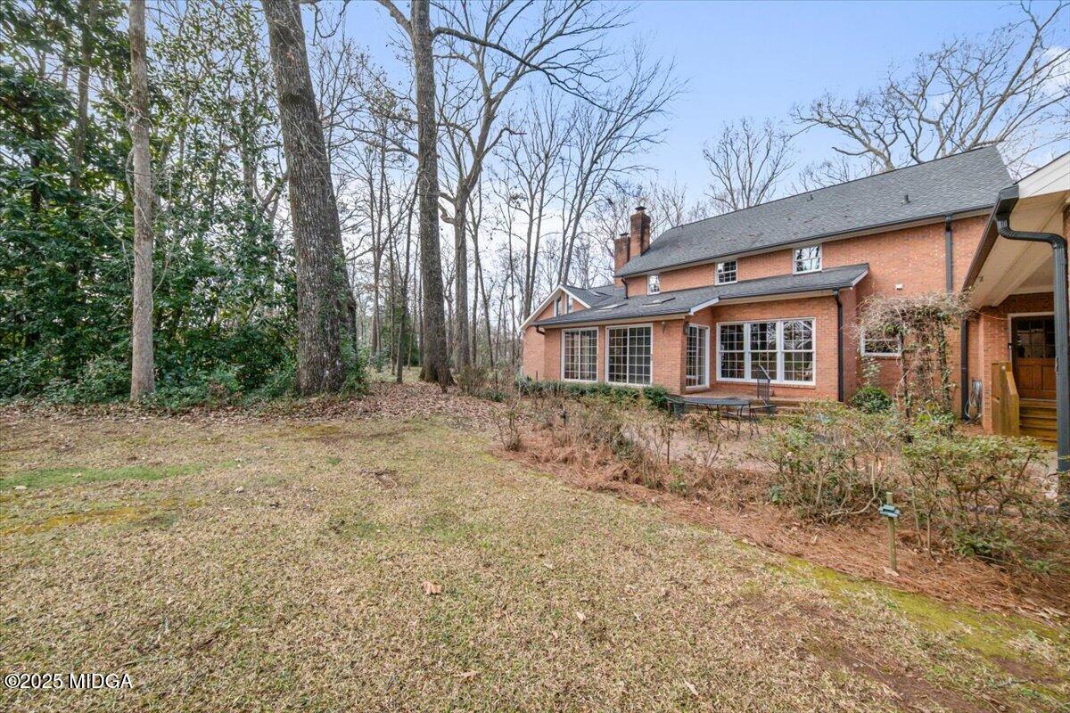 1439 Old Forsyth Road Macon, GA 31210 - Photo 52 of 56 a front view of a house with a yard