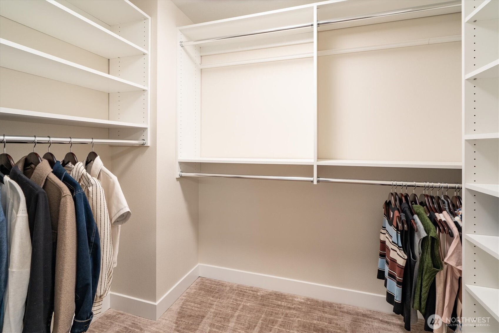 9503 Odin Way Bothell, WA 98011 - Photo 26 of 39 a view of walk in closet with clothes and shoes