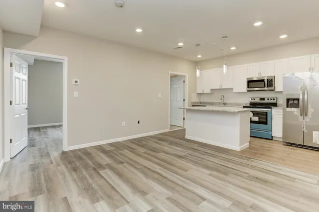 a view of kitchen kitchen microwave and stove