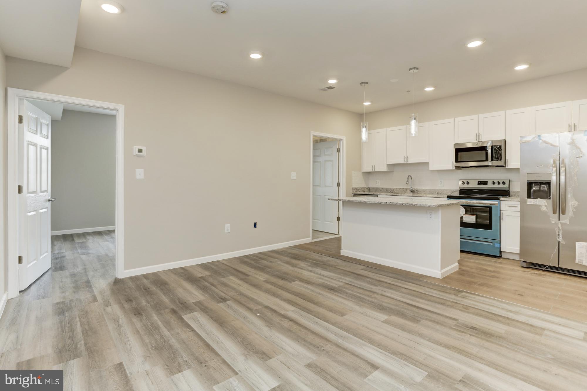 1923 Ashland Avenue, Unit 303 Baltimore, MD 21205 - Photo 2 of 13 a view of kitchen kitchen microwave and stove