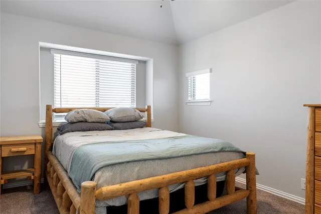 a bathroom with a sink a toilet and shower curtain