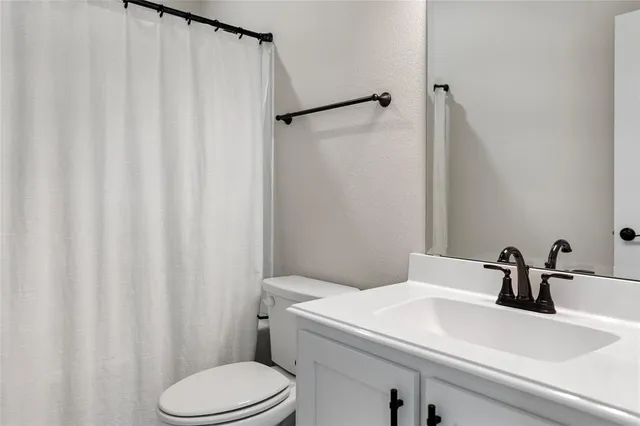 a front view of a house with a yard outdoor seating and garage