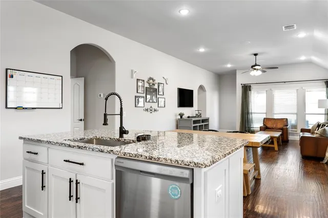 a view of living room with granite countertop furniture and fireplace
