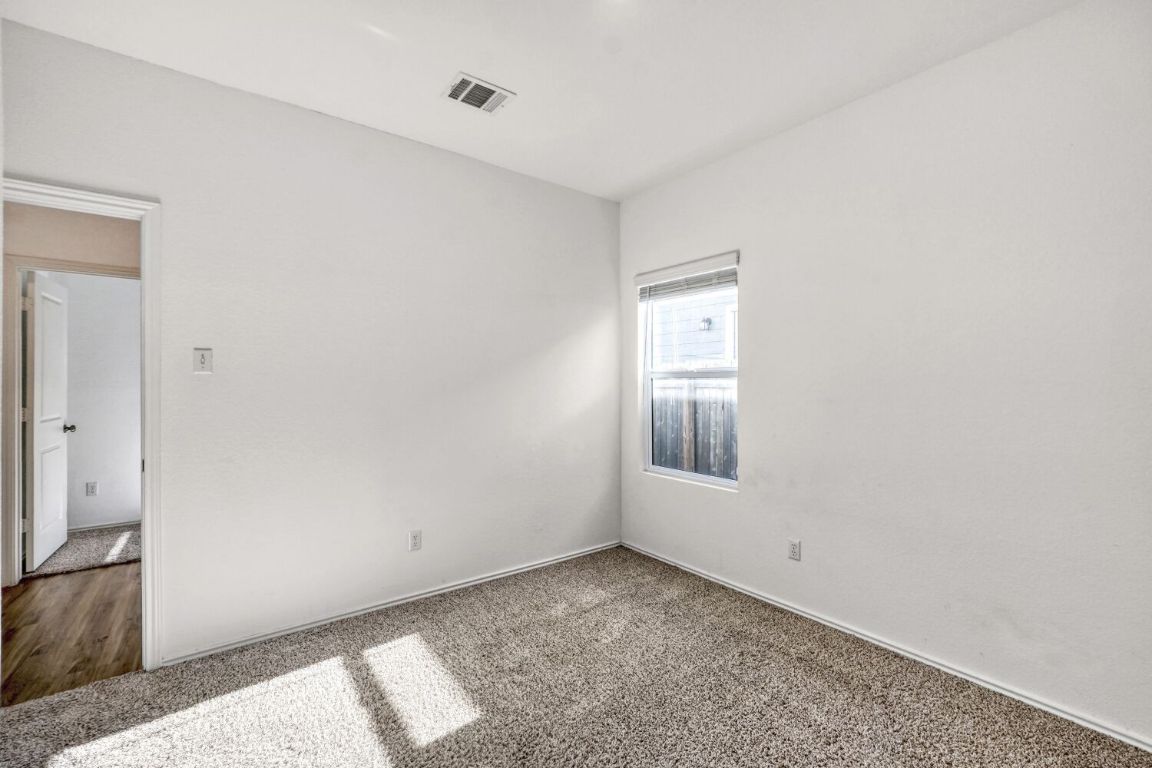 385 Geode Glen Maxwell, TX 78656 - Photo 14 of 16 Empty room with carpet