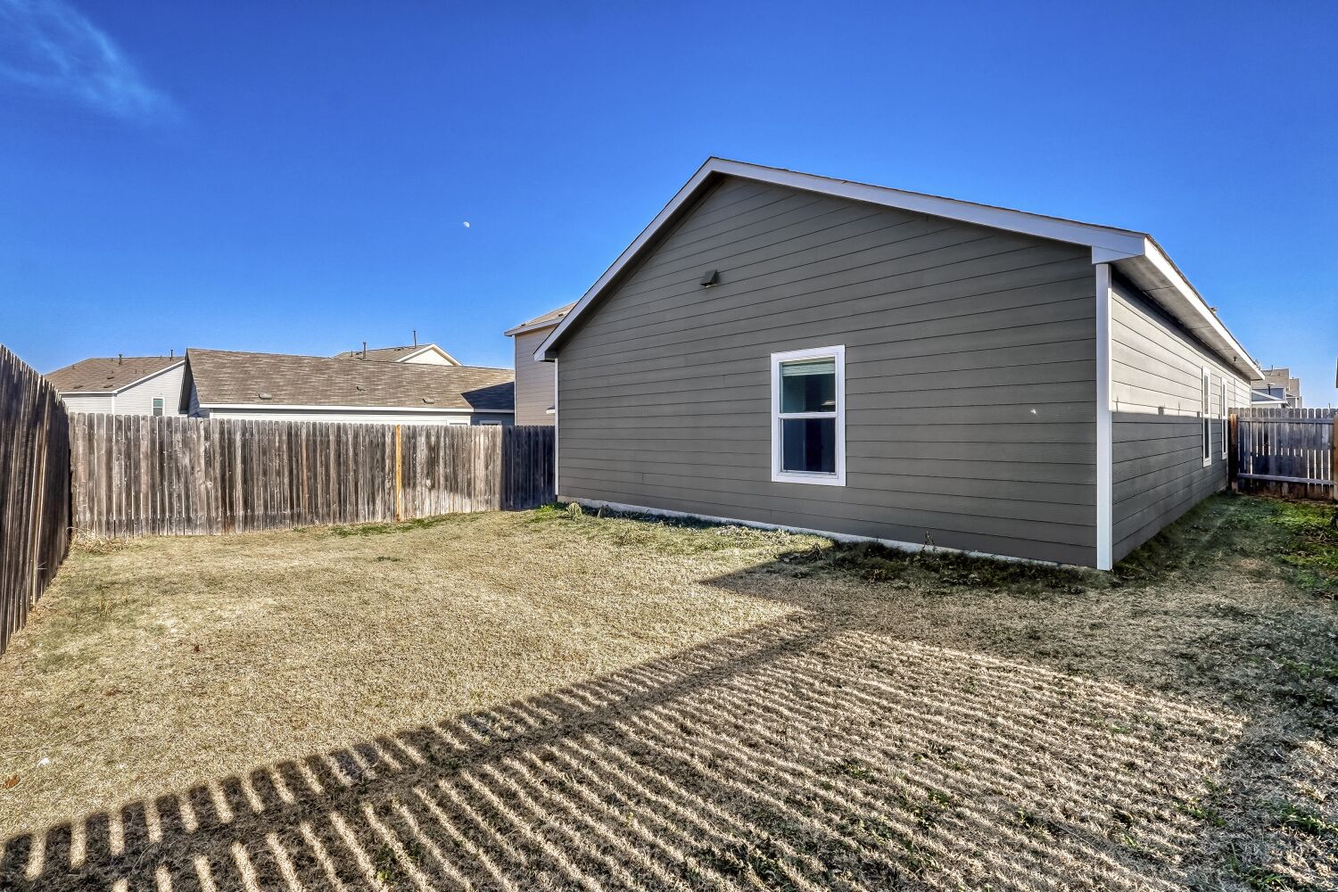 385 Geode Glen Maxwell, TX 78656 - Photo 16 of 16 View of side of home featuring a fenced backyard