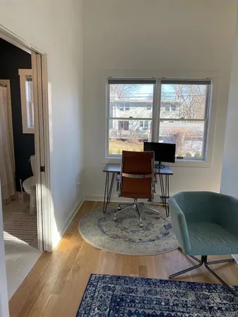 a work room with a table and windows