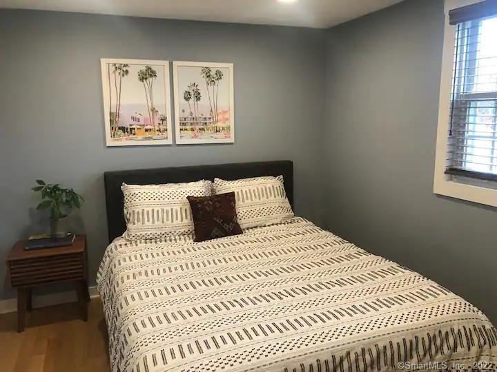 8 Clinton Avenue Old Saybrook, CT 06475 - Photo 12 of 23 a bedroom with a bed and a window