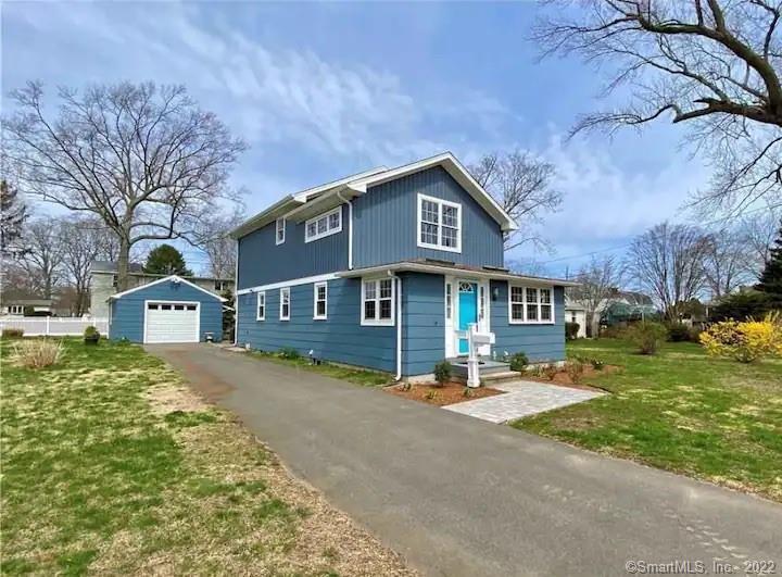 8 Clinton Avenue Old Saybrook, CT 06475 - Photo 23 of 23 a front view of a house with a yard
