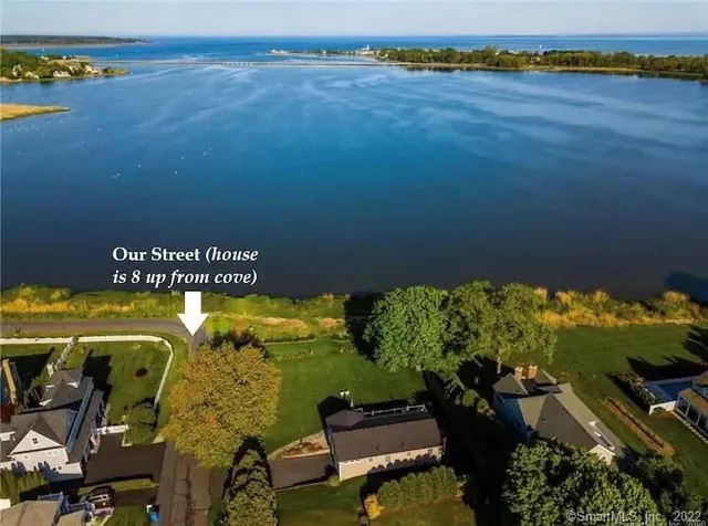 an aerial view of a house with a swimming pool