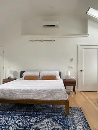 a bedroom with a bed and a table in it