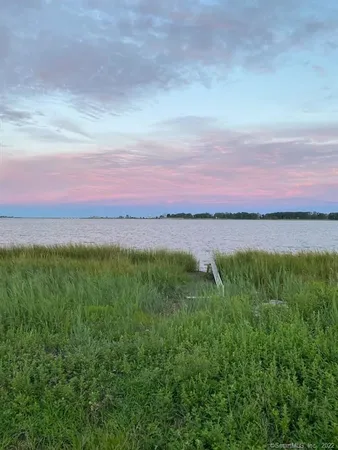 a view of a lake and sunset