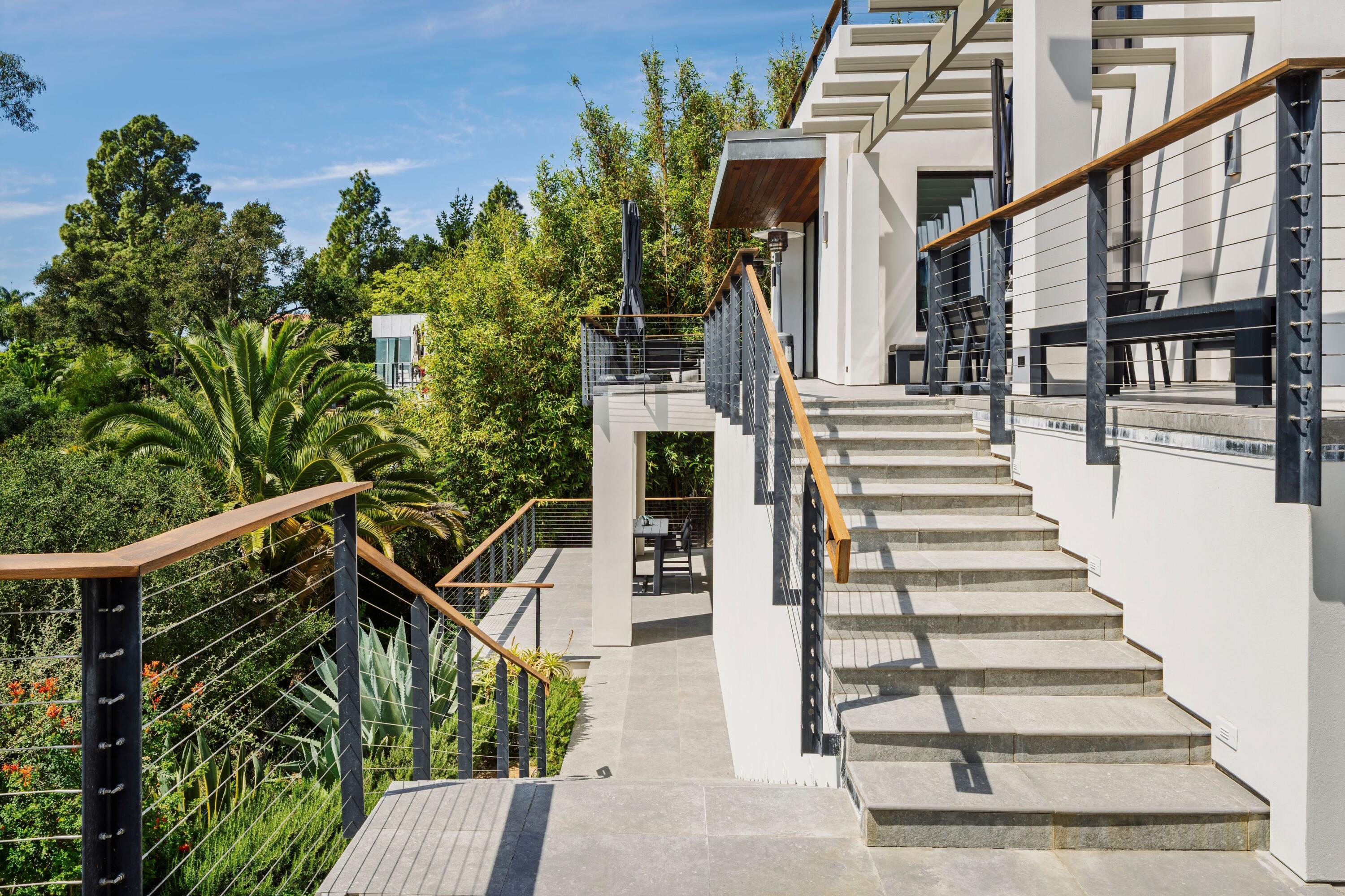 6. Outdoor Lounge with Fire Pit and Palm