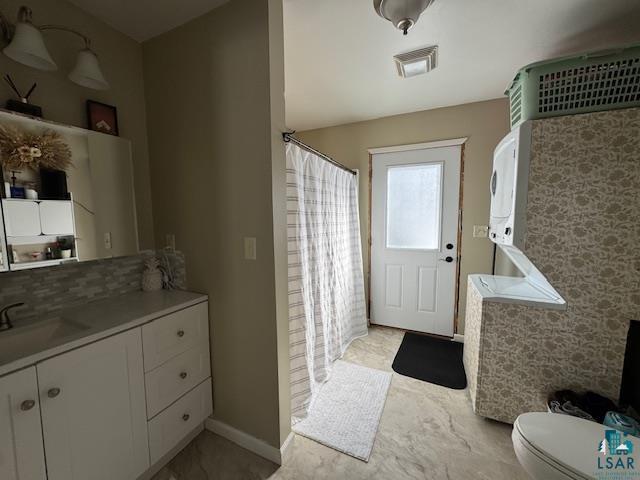 15081 Old Hart Lake Road Goodland, MN 55742 - Photo 12 of 18 Doorway to outside with a sink and baseboards