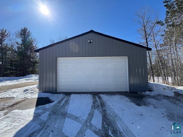15081 Old Hart Lake Road Goodland, MN 55742 - Photo 14 of 18 Snow covered garage with a garage