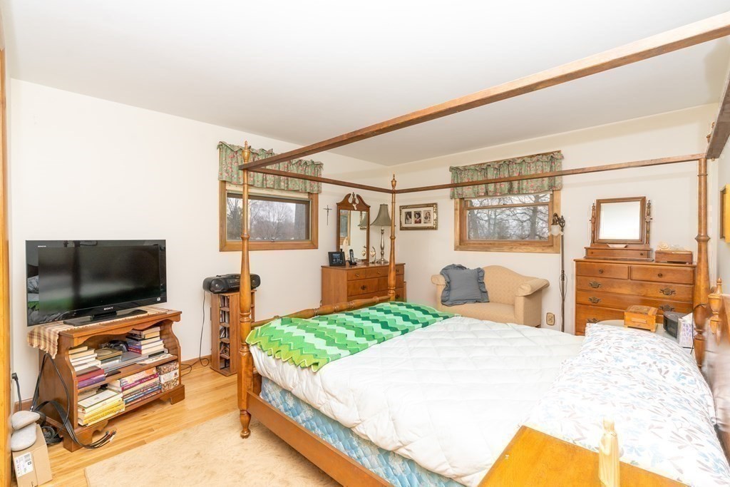 139 West Meadowview Road Holyoke, MA 01040 - Photo 21 of 33 a bedroom with a bed and a flat screen tv