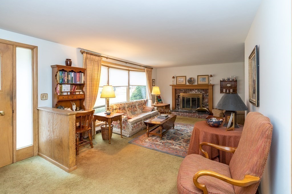 139 West Meadowview Road Holyoke, MA 01040 - Photo 6 of 33 a living room with furniture a window and a flat screen tv
