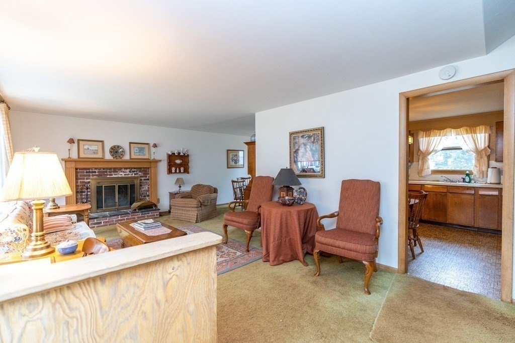 139 West Meadowview Road Holyoke, MA 01040 - Photo 9 of 33 a living room with furniture and a fireplace