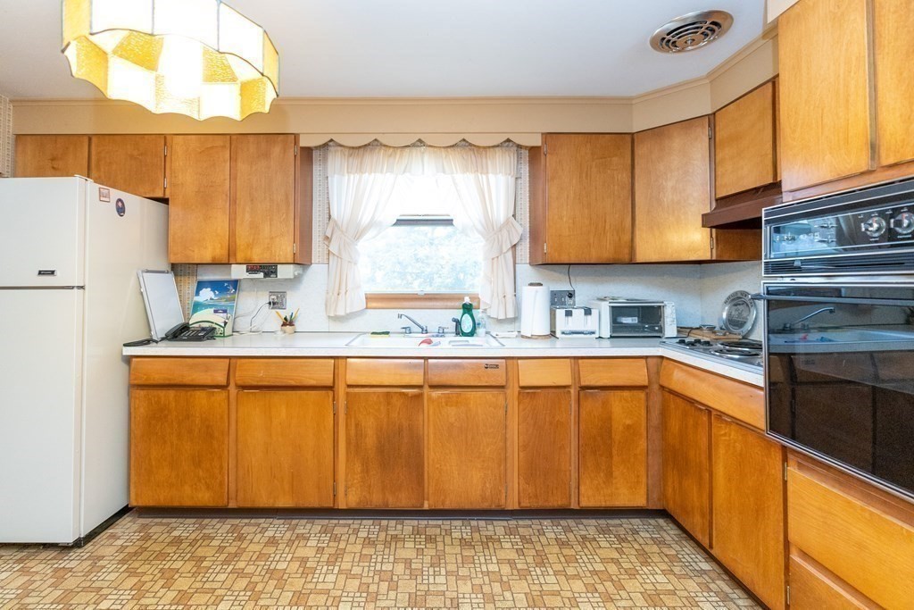 139 West Meadowview Road Holyoke, MA 01040 - Photo 10 of 33 a kitchen with stainless steel appliances granite countertop a refrigerator sink and cabinets