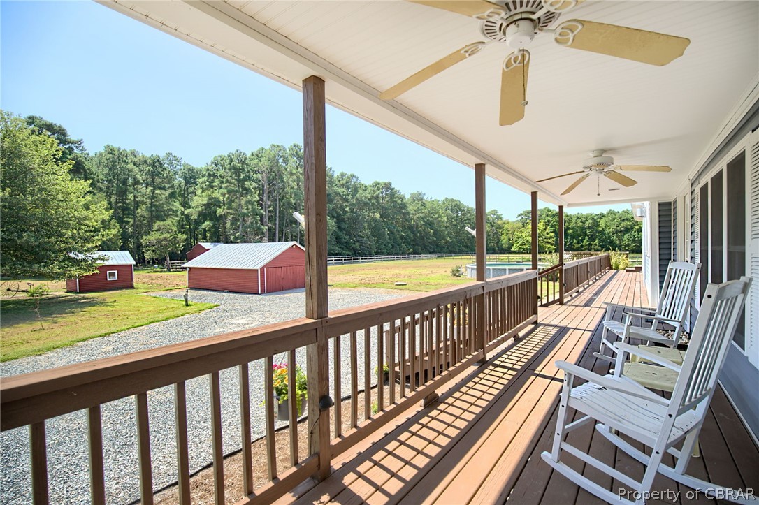 398 Kings Landing Road Onemo, VA 23130 - Photo 17 of 41 A long and wide country front porch with 2 ceiling fans.