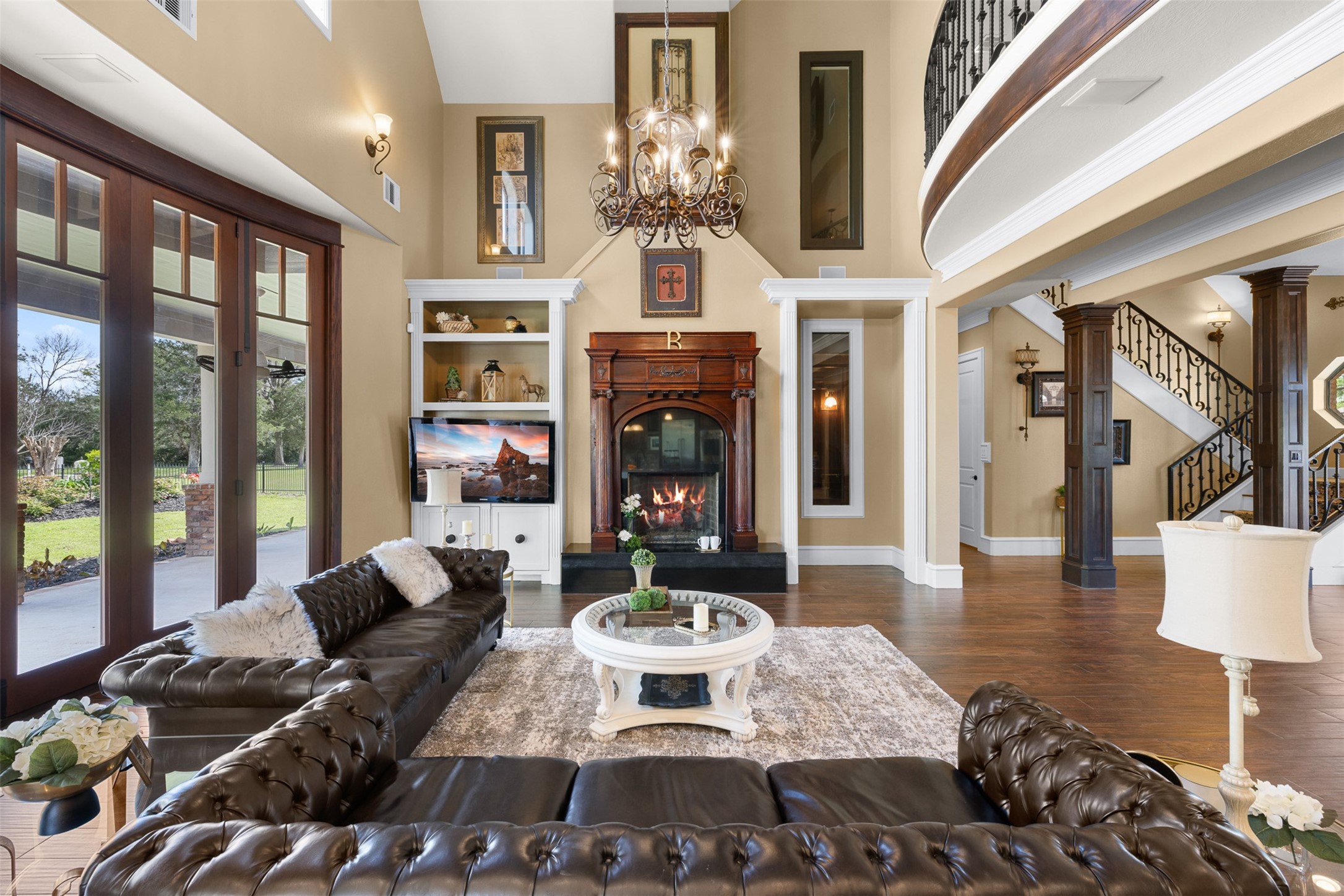 29500 Skymac Ranch Road Hempstead, TX 77445 - Photo 10 of 50 a living room with furniture a fireplace and a chandelier