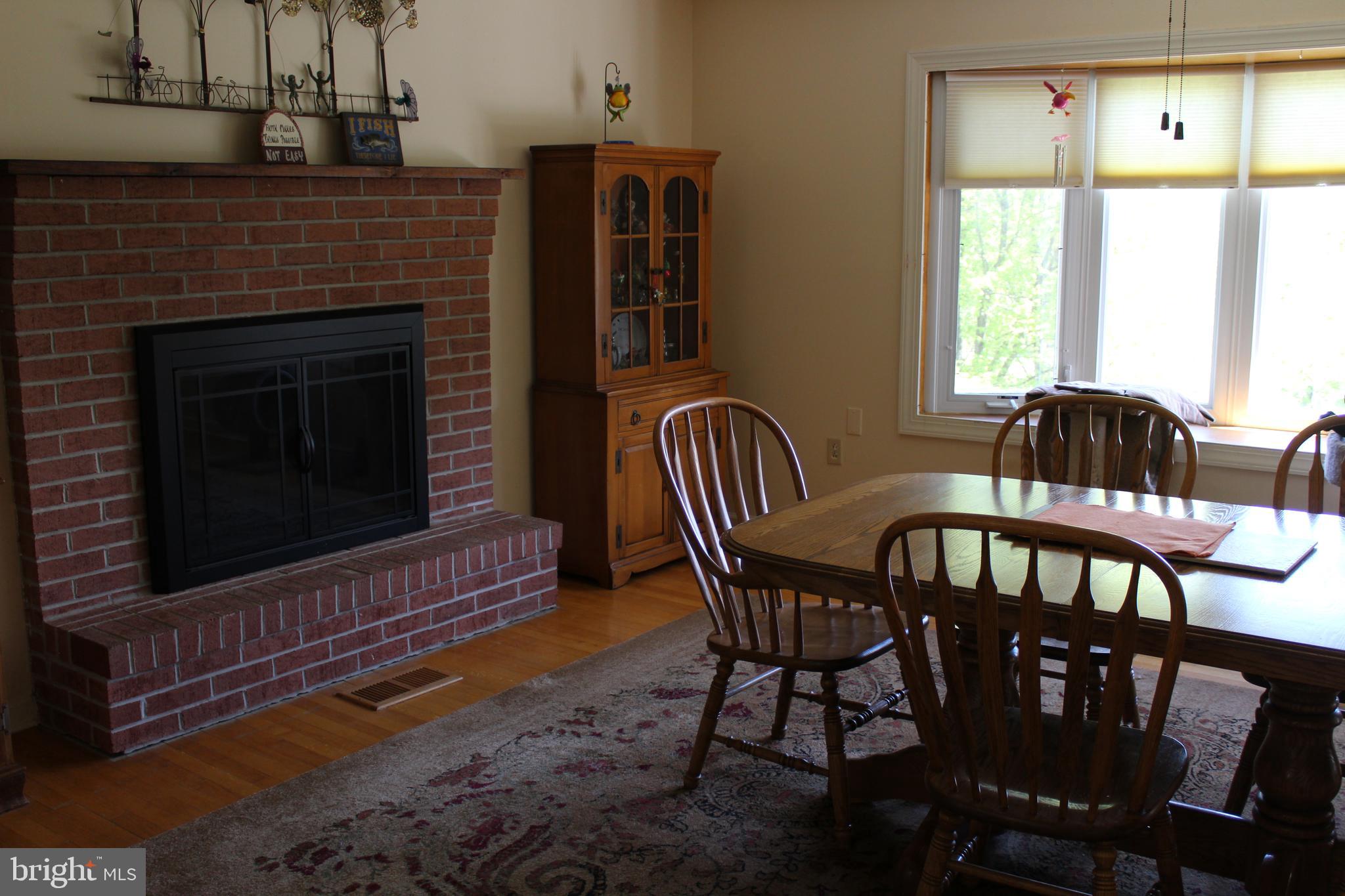 264 North Hayfield Road Winchester, VA 22603 - Photo 15 of 62 Large dining room with wood burning FP