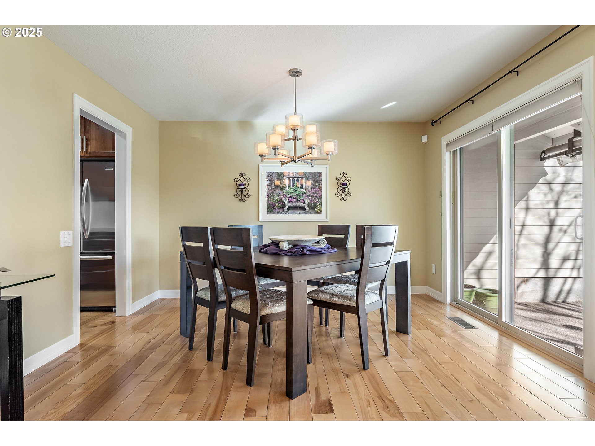 10350 Southwest Greenleaf Terrace Portland, OR 97224 - Photo 11 of 32 a view of a dining room with furniture and wooden floor