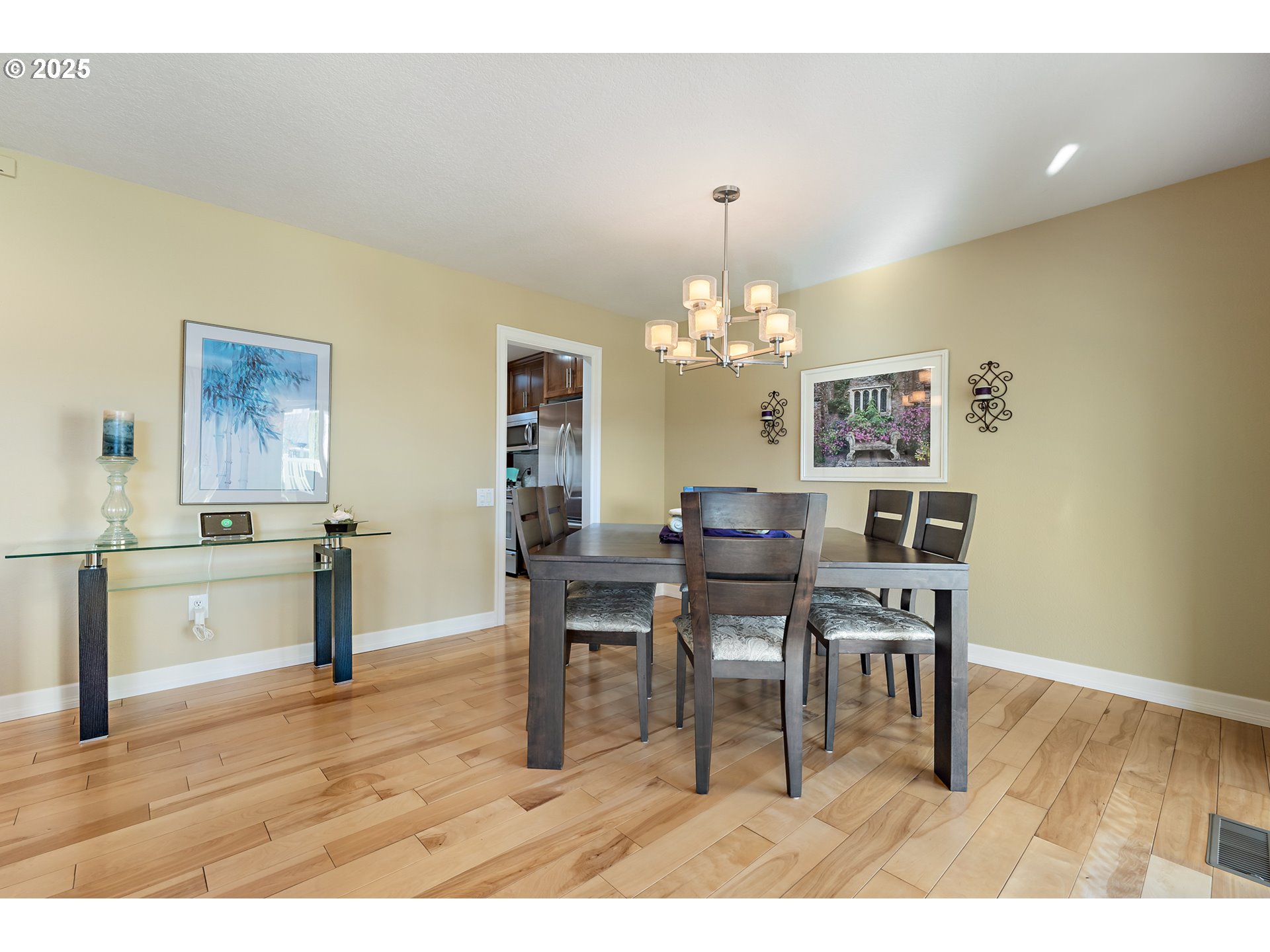 10350 Southwest Greenleaf Terrace Portland, OR 97224 - Photo 12 of 32 a dining room with furniture a chandelier and wooden floor