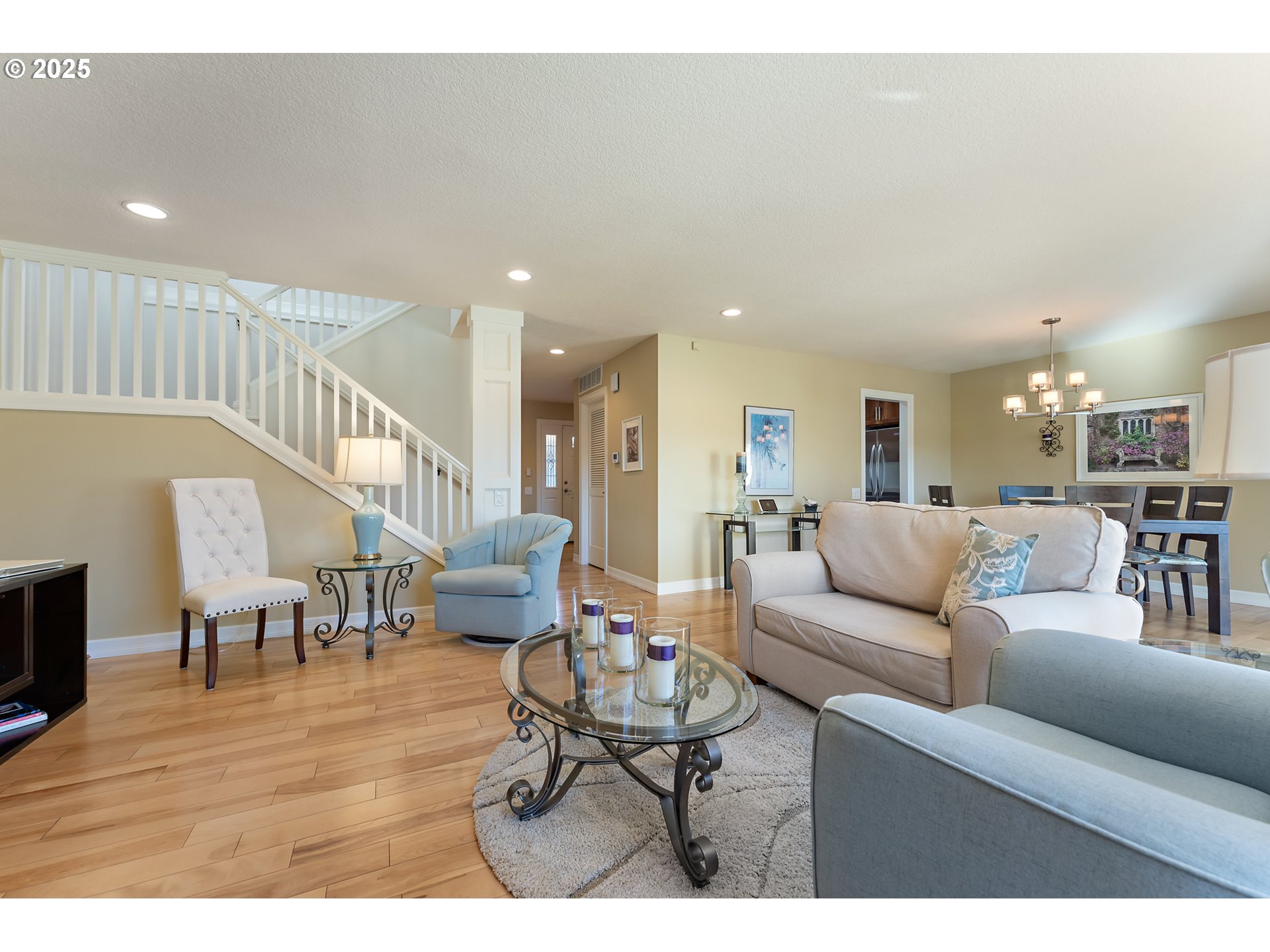 10350 Southwest Greenleaf Terrace Portland, OR 97224 - Photo 16 of 32 a living room with furniture kitchen view and a wooden floor