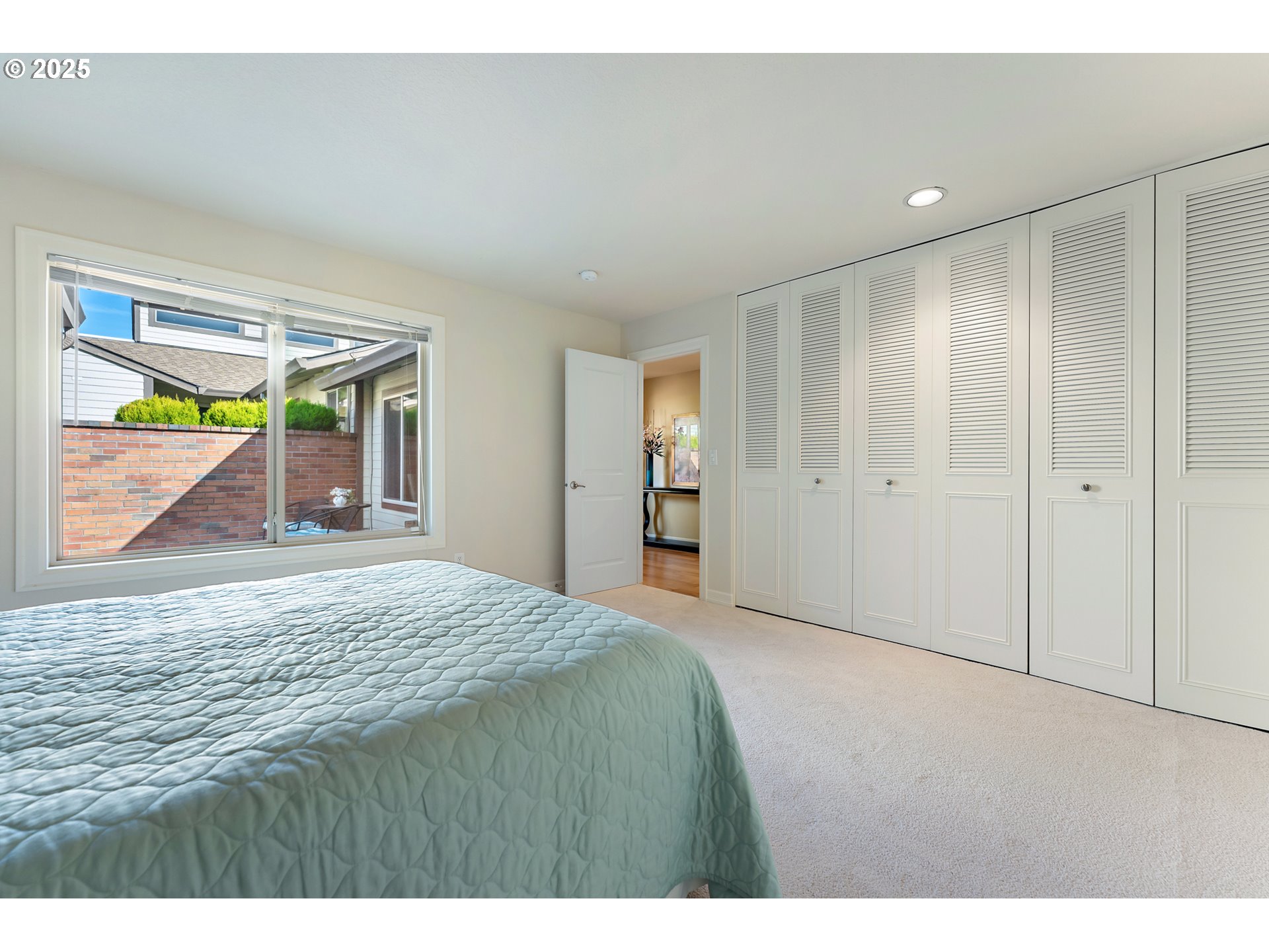 10350 Southwest Greenleaf Terrace Portland, OR 97224 - Photo 19 of 32 a bedroom with a bed and a dresser
