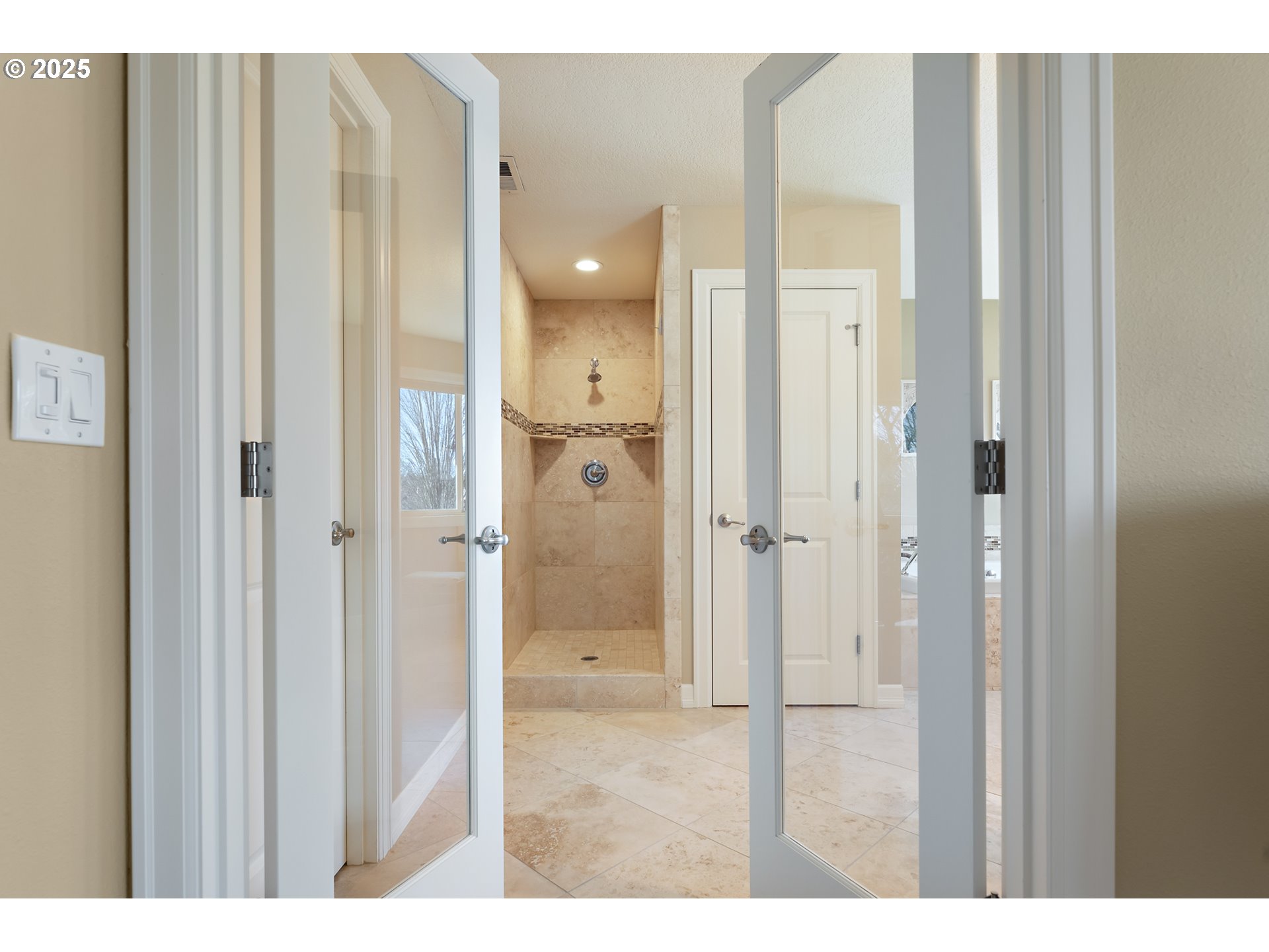 10350 Southwest Greenleaf Terrace Portland, OR 97224 - Photo 22 of 32 a bathroom with a glass shower door
