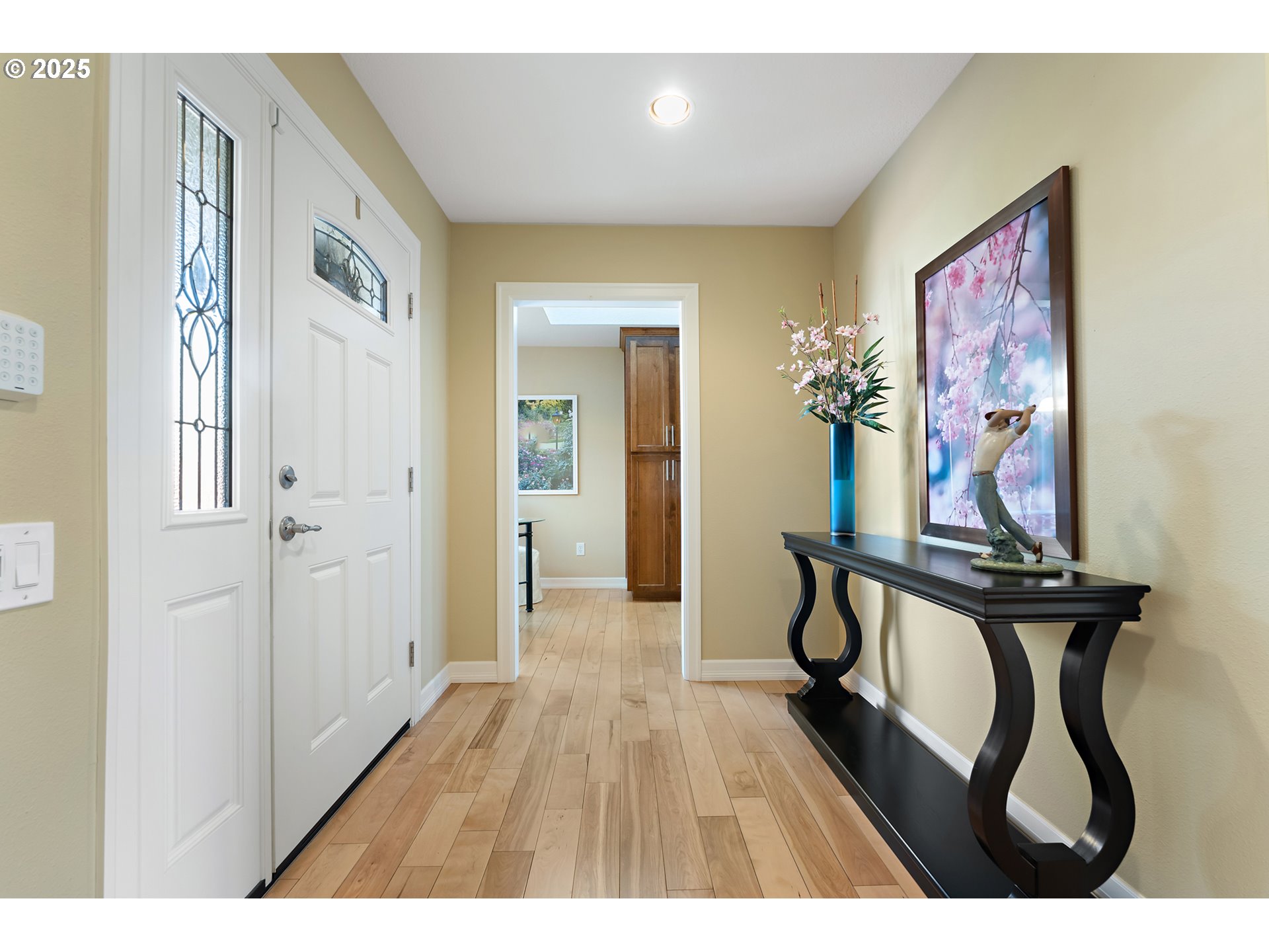 10350 Southwest Greenleaf Terrace Portland, OR 97224 - Photo 5 of 32 a view of a hallway with wooden floor and furniture