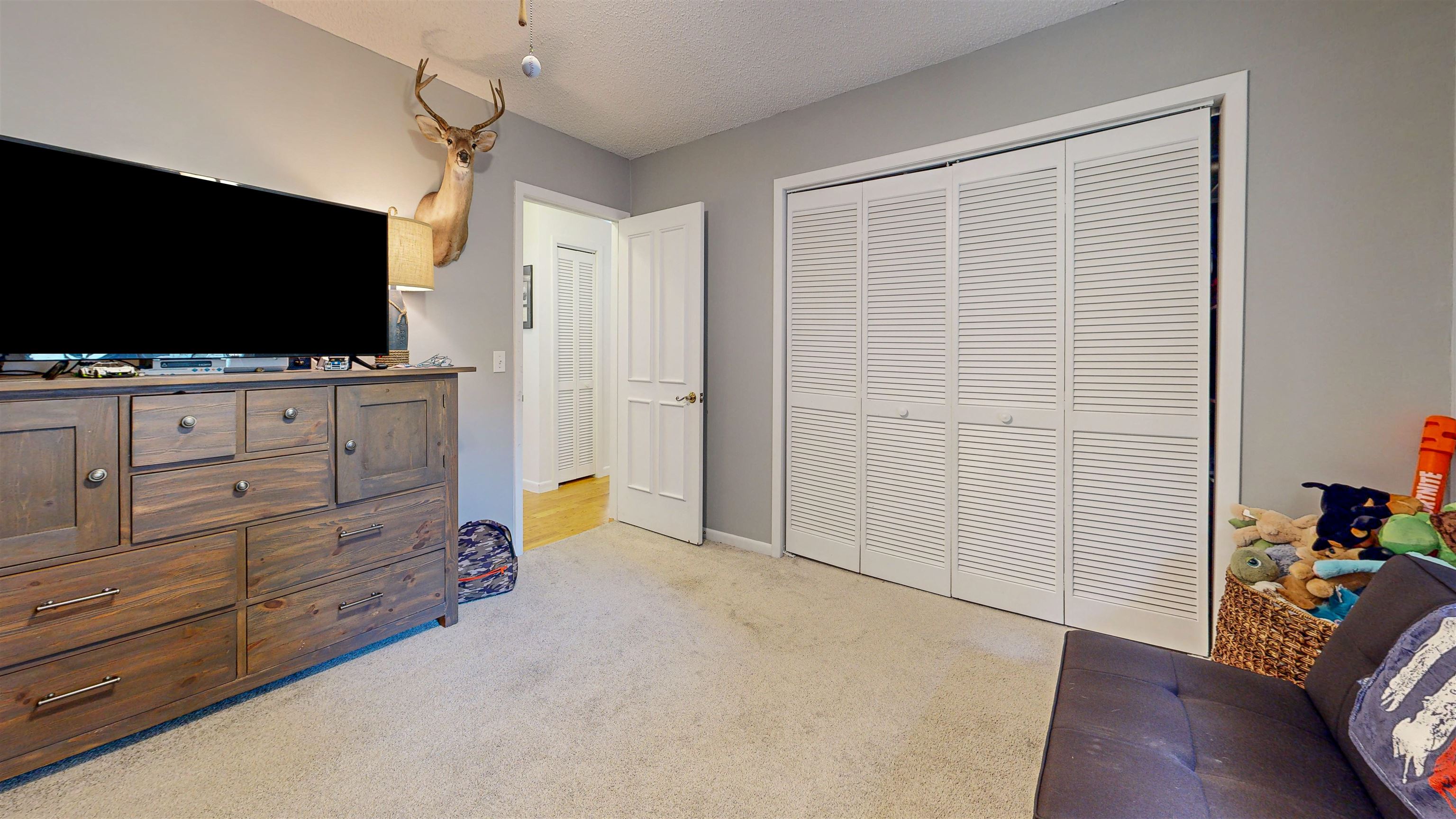 181 Hawthorne Road St. Augustine, FL 32086 - Photo 30 of 48 a view of room with cabinet flat screen tv and wooden floor