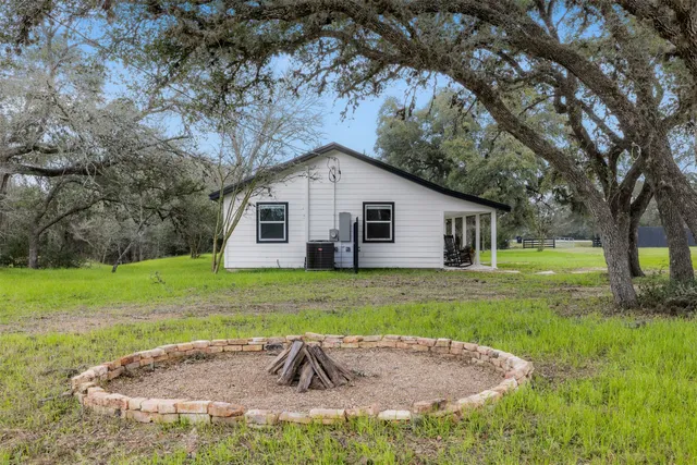 a view of a lake with houses in the background