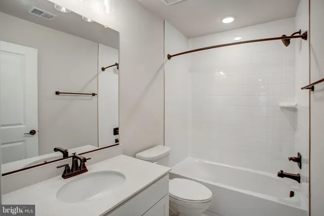 a bathroom with a sink toilet and a bathtub