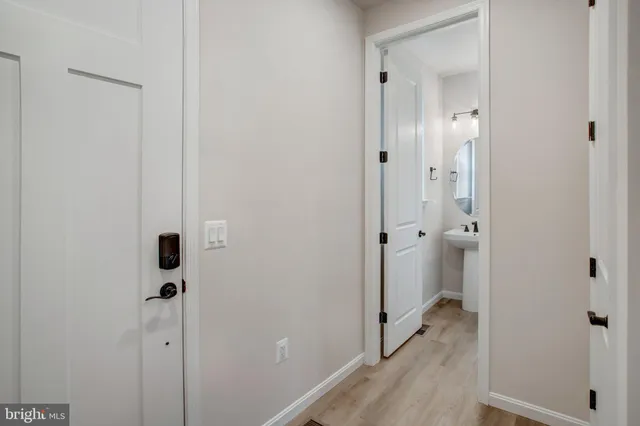 a view of a bathroom from a hallway