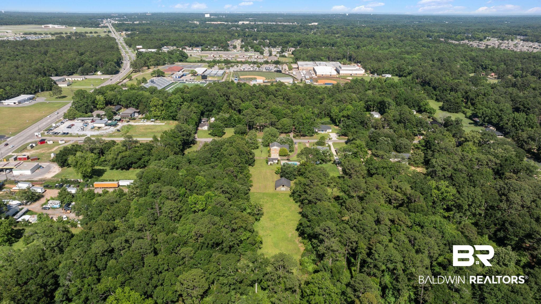 950 Walter Smith Road Mobile, AL 36695 - Photo 46 of 51 Aerial overview of property's location with a heavily wooded area