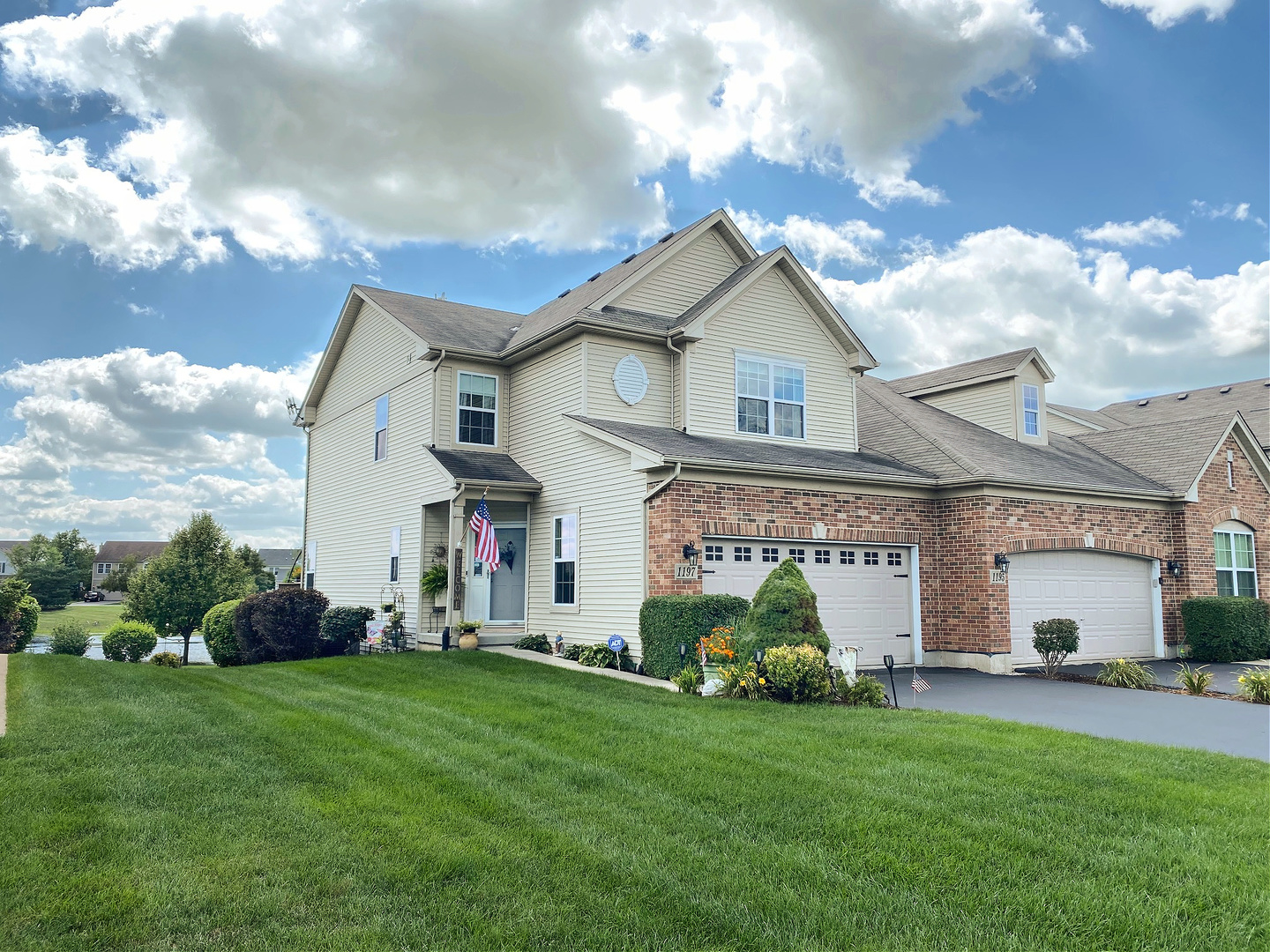 1197 Freedom Road Elburn, IL 60119 - Photo 1 of 31 a view of a white house that has a small yard and a large tree