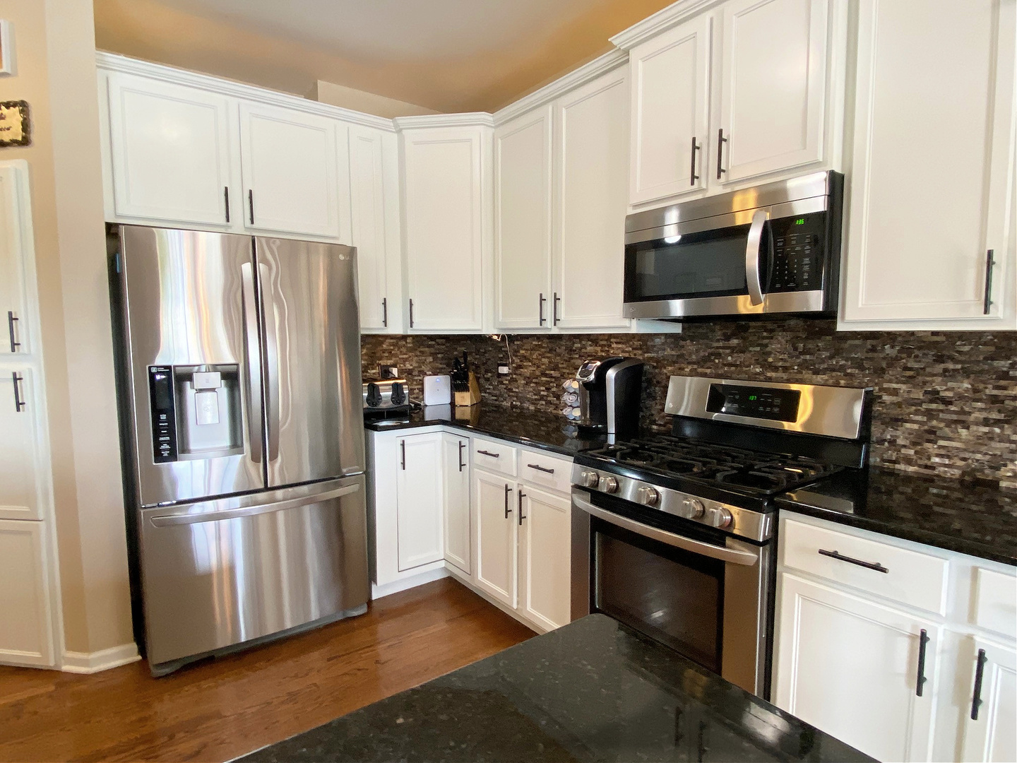 1197 Freedom Road Elburn, IL 60119 - Photo 11 of 31 a kitchen with stainless steel appliances a refrigerator stove microwave and sink