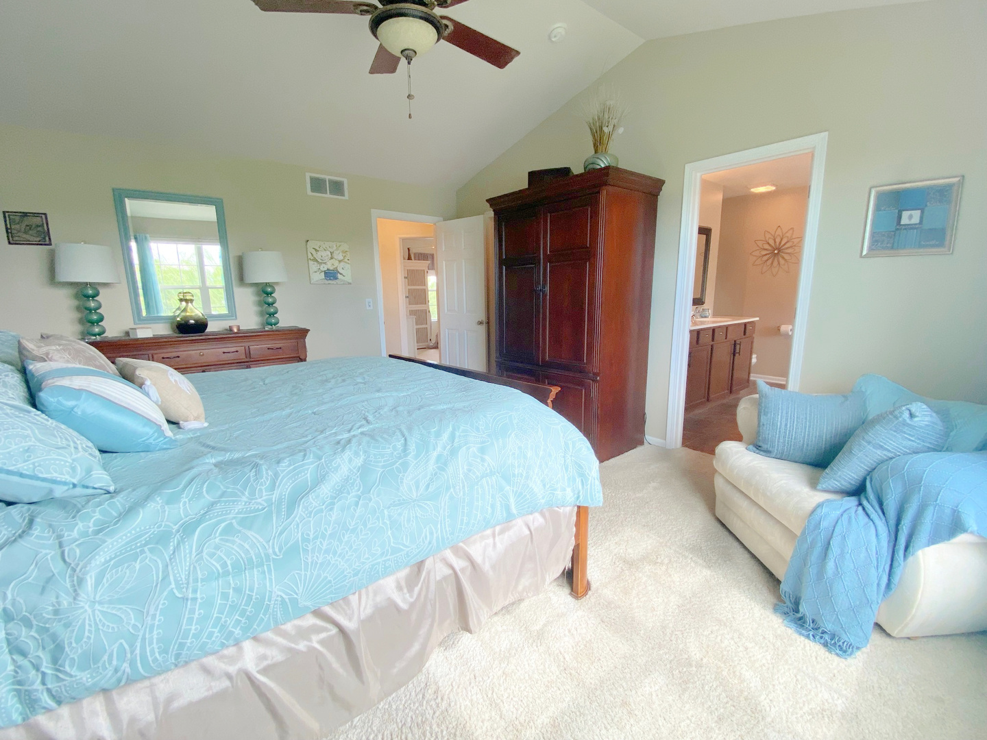 1197 Freedom Road Elburn, IL 60119 - Photo 17 of 31 a spacious bedroom with a bed a couch and dresser