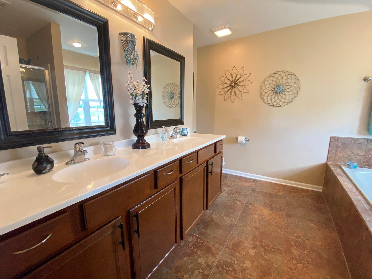 1197 Freedom Road Elburn, IL 60119 - Photo 18 of 31 a bathroom with a double vanity sink and a mirror