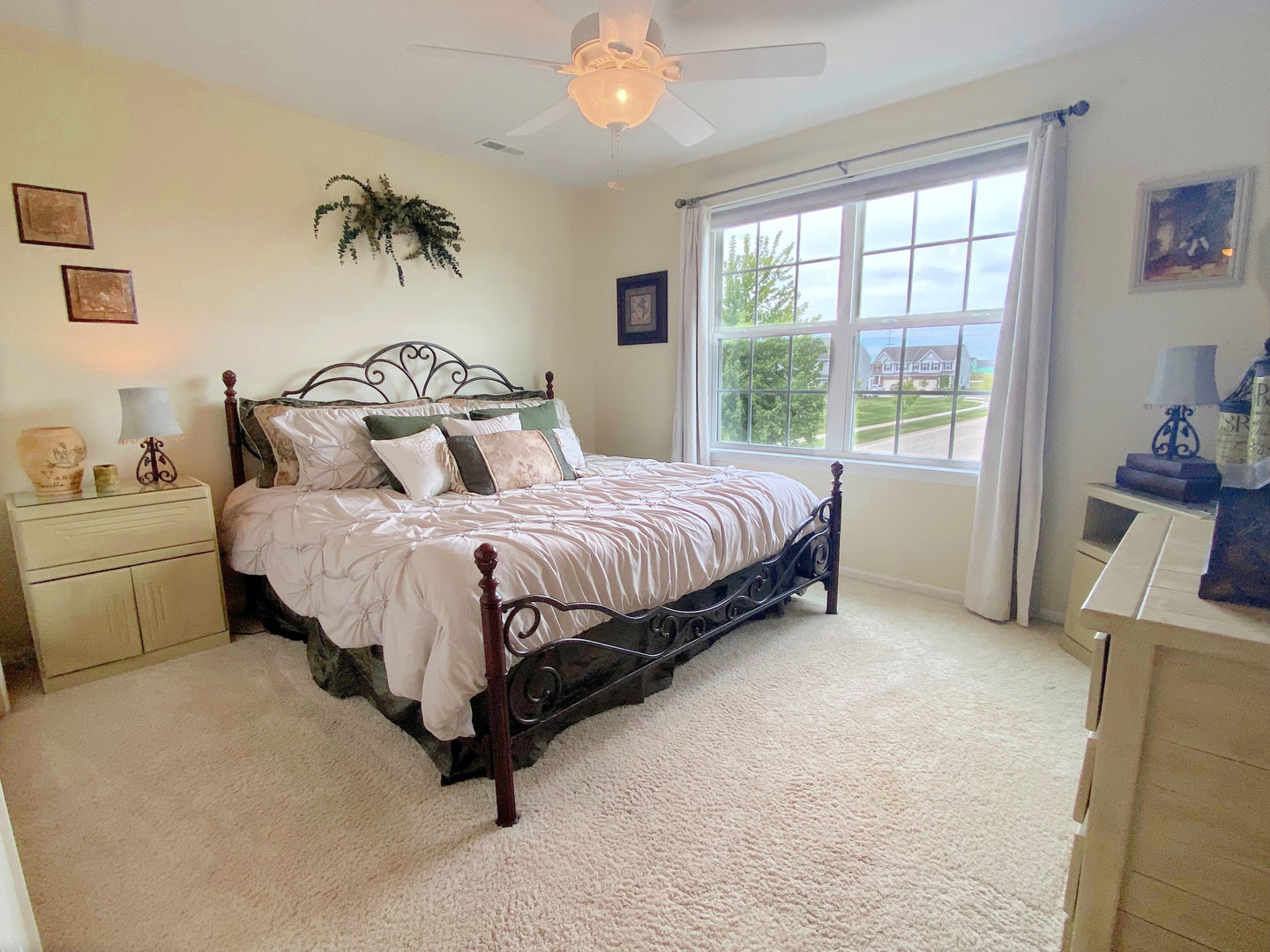 1197 Freedom Road Elburn, IL 60119 - Photo 19 of 31 a bedroom with a large bed and a chandelier
