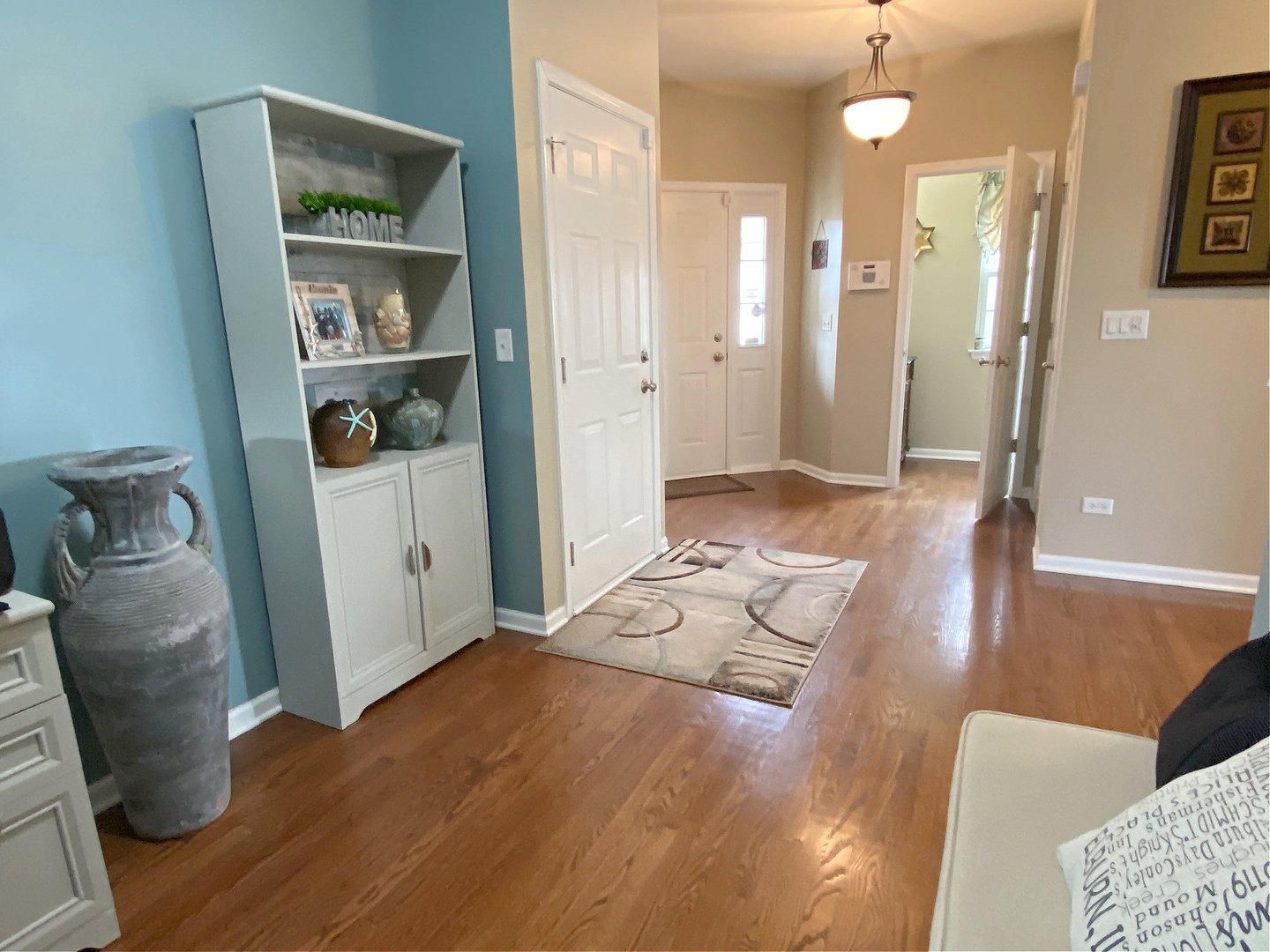 1197 Freedom Road Elburn, IL 60119 - Photo 3 of 31 a living room with furniture and a rug
