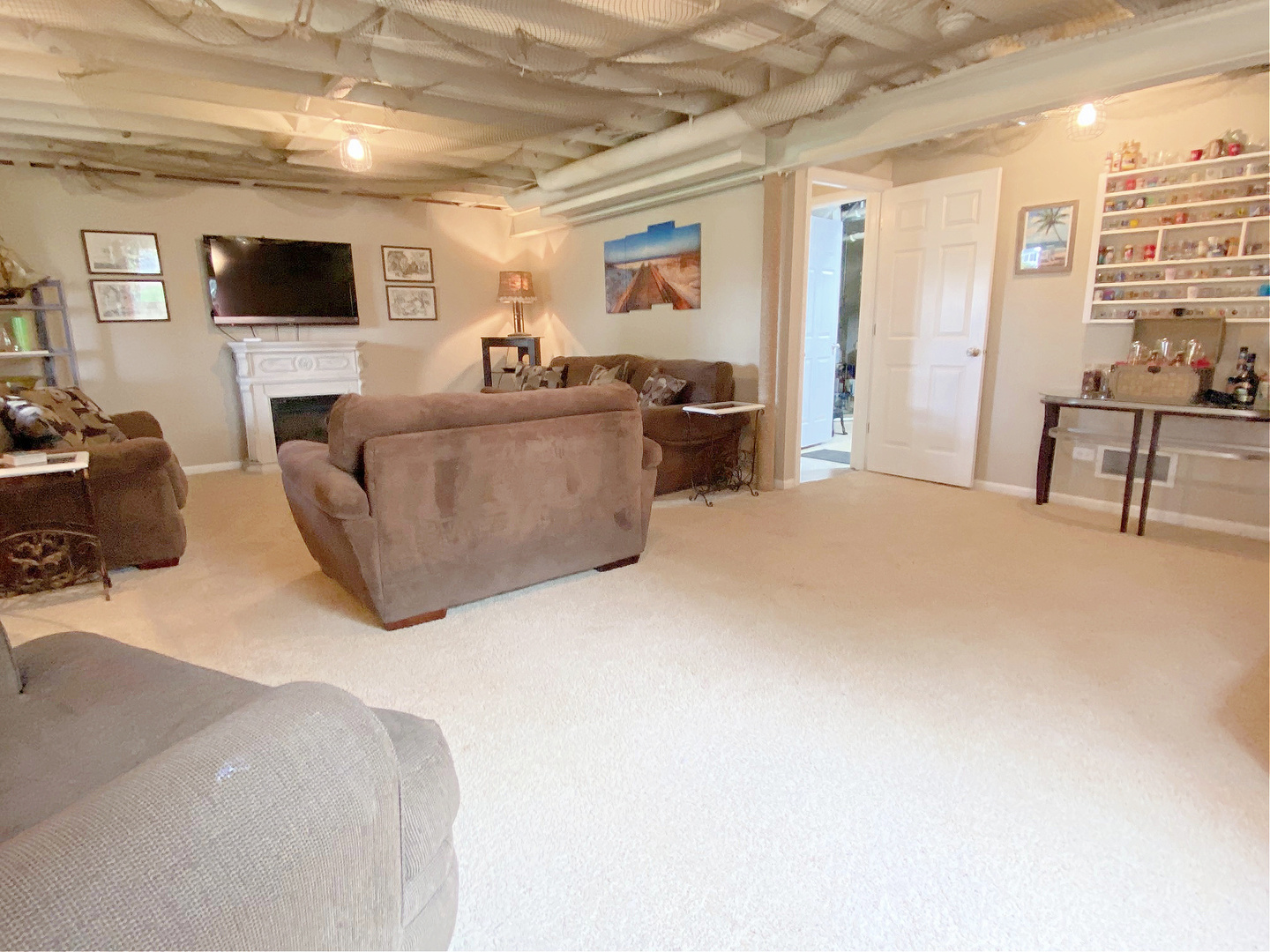 1197 Freedom Road Elburn, IL 60119 - Photo 25 of 31 a living room with furniture and a flat screen tv